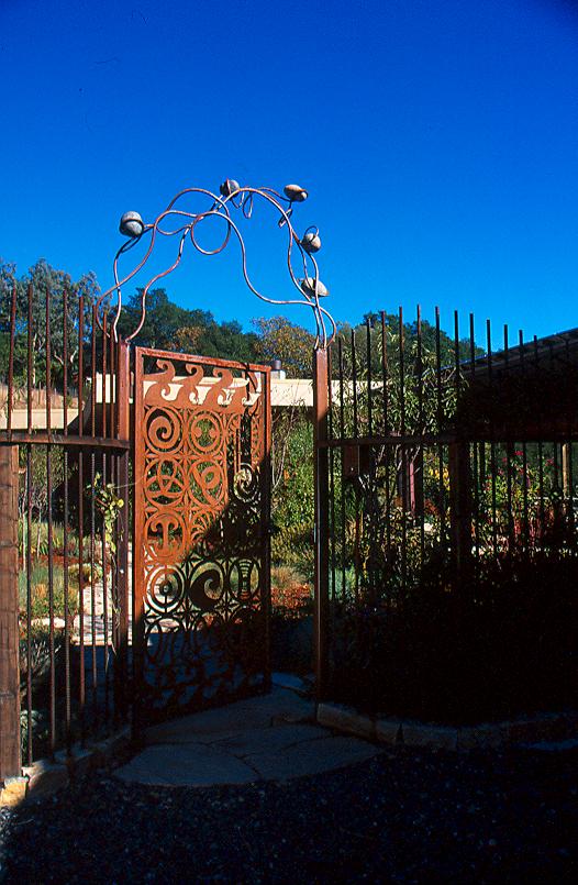 The front gate’s design, by metal artist Amy Blackstone, incorporates symbols from nature that Karen selected from a permaculture handbook.